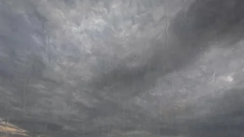 Sky timelapse of heavy rain dark storm clouds and water drops - loop video Stock Footage 247136442