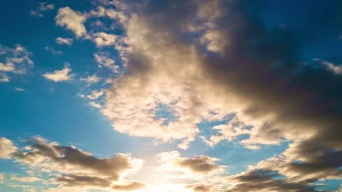 Sky timelapse. Moving clouds and sun. White fluffy clouds slowly float through Stock Footage 300413066