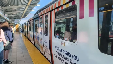 Sky train metro train arriving at the platform in Vancouver. Stock Footage 345732010