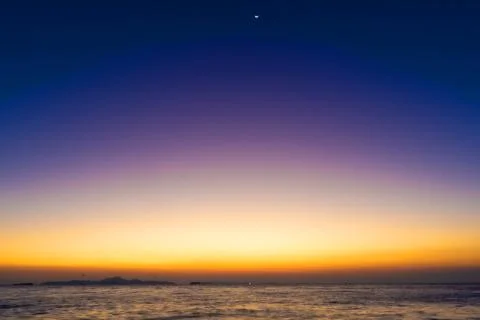Sky on twilight time and reflection on the sea in the beach Stock Photos