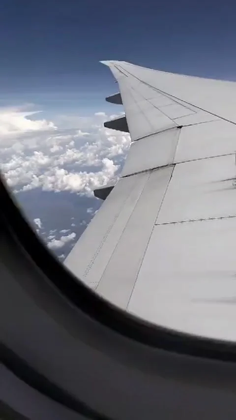 Sky view from an airplane window Stock Footage 299018942