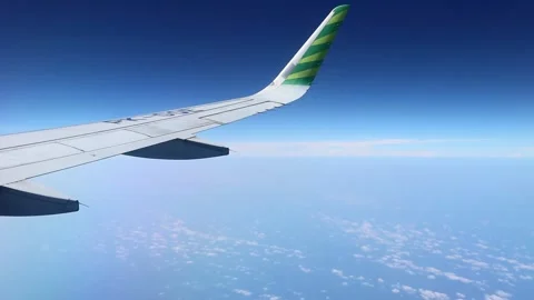 Sky view from airplane windows with a wing. Top view from a plane. Stock Footage 287416184