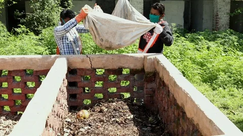 Sky view of garbage disposal trash dump or open landfill, India Stock Footage 128124368