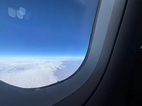 Sky View Through the Airplane Window Stock Photos