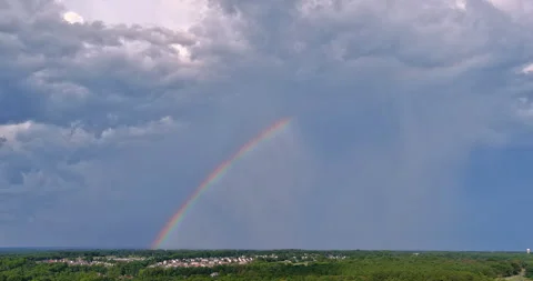 Sky was adorned with vibrant rainbow after a powerful thunderstorm. Stock Footage 244609236