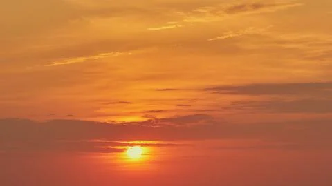 The sky was filled with clouds, but the sunset still shone through, timelapse Stock Photos