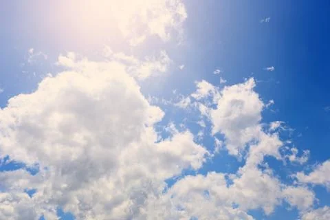 The sky with white clouds and illumination from the Sun Stock Photos