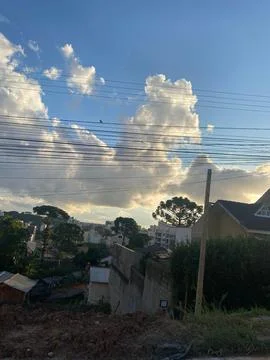 Sky with white clouds over rough terrain 스톡 사진