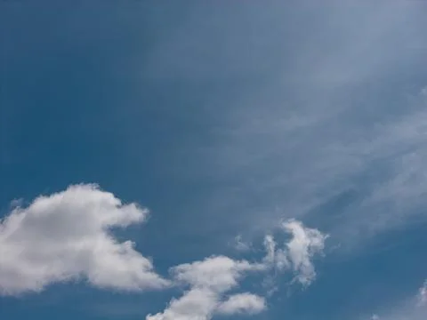 Sky with white cumulus clouds on a clear day Stock-Fotos