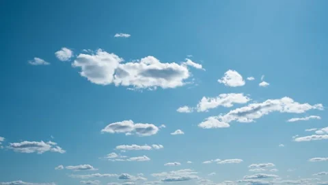 Sky with white cumulus clouds on a midday sunny day Stock Footage 243850347