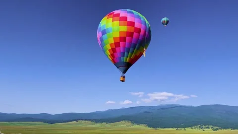 Skybound: Checkered Balloon Above the Valley Video stock 339268139