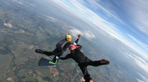 Skydive couple team making figures in free fall Stock Footage 111793759