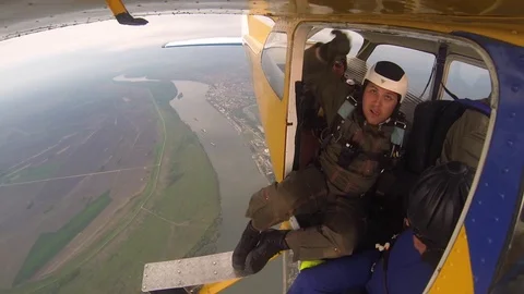 File:Skydiver exiting aircraft with static line still attached.jpg