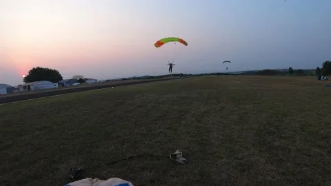 Skydive group landing at the sunset Stock Footage 132759180