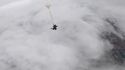 Skydive tandem above the clouds Stock Footage 157561222