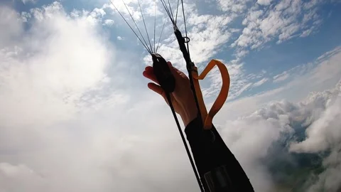 Skydiver adjusts and corrects lines to start piloting Stock Footage 236849969