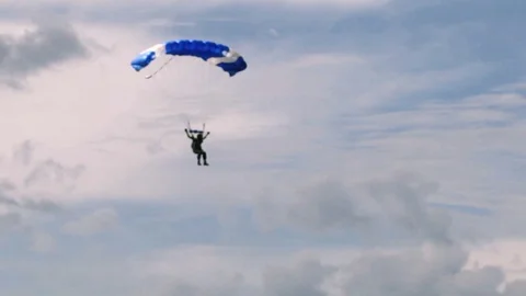 Skydiver approaches earth Stock Footage 99268424