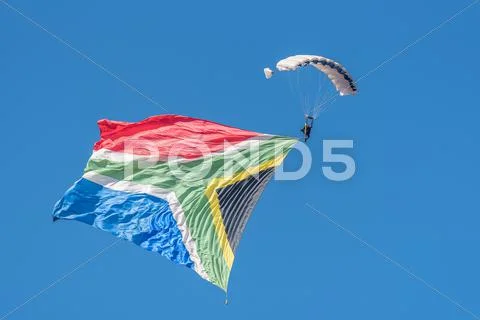 Skydiver with big flag Stock Photos
