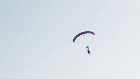 Skydiver in the blue sky in the sun Stock Footage 133335951