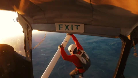 Skydiver at the exit of an airplane ready to jump Stock Footage 264502977