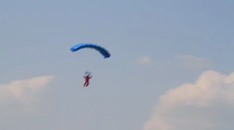 Skydiver flying in front of a cloud Stock Footage 33380303