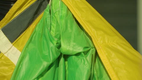Skydiver Folding The Parachute Canopy. - close up Stock Footage 247189306
