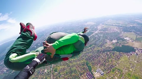 Skydiver in free fall opening parachute Stock Footage 68858664