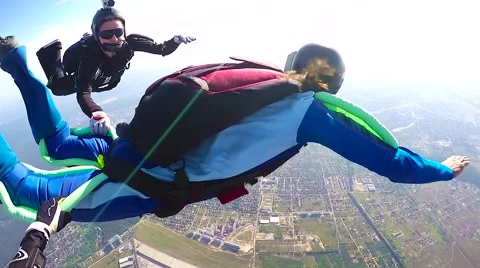 Skydiver in free fall opening parachute Stock Footage 68858876