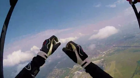 Skydiver in free fall thumbs up Stock Footage 69125524