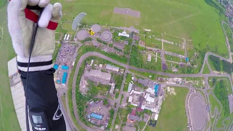 Skydiver gliding over land Video stock 69121874