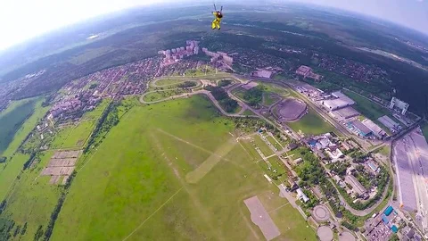 Skydiver gliding over land Video stock 69122952