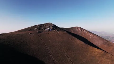 Skydiver hovers weightless above the ground after taking off from the fields. A 動画素材 267968357