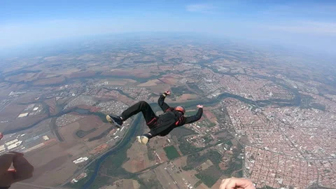 Skydiver learning back fly. Point of view of instructor. Stock Footage 163927331