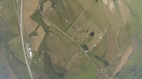Skydiver opening their parachute and parachuting down. 스톡 동영상 68010010