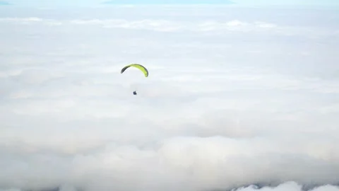 Skydiver or Paraglider over Clouds Stock Footage 92512397