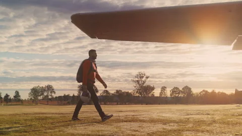 Skydiver in the orange jacket ready to enter the airplane Stock Footage 263999371