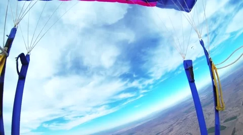 Skydiver parachuting in cloudy grey sky. Extreme. Adrenaline. Above arizona Видео 67426099
