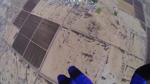 Skydiver parachuting in cloudy grey sky. Scenery. Adrenaline. Above arizona Видео 67426166