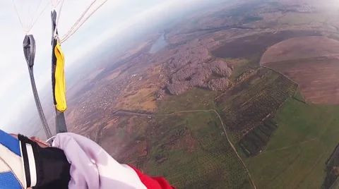 Skydiver parachuting in cloudy sky in evening. Extreme sport. Professional Stock Footage 66748168