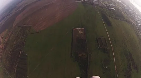 Skydiver parachuting in cloudy sky in evening above fields. Extreme. Landscape Видео 66748209