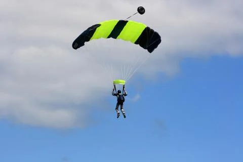 Skydiver parachuting down to the earth. Foto stock