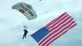 Skydiver Parachuting With Flag HD Footage