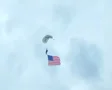 Skydiver Parachuting With Flag SD Footage