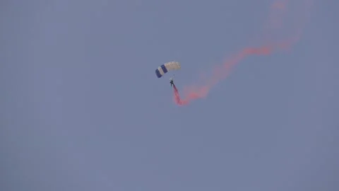 Skydiver parachuting out of sky Stock Footage 159607960