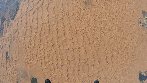 Skydiver parachuting over the desert dunes 스톡 동영상 101737514