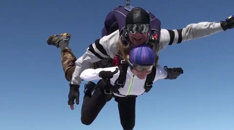 Skydiver with passenger in  tandem freefall Stock-Footage 66286361