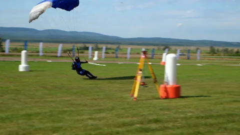 Skydiver Performs Difficult Landing at High Speed. Parachuting Competitions Stock Footage 146509366