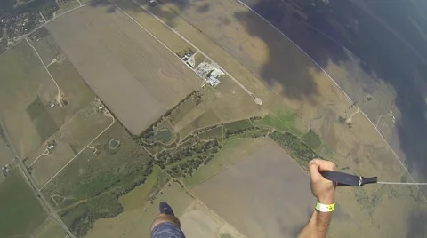 A skydiver spins while parachuting. 스톡 동영상 68010059