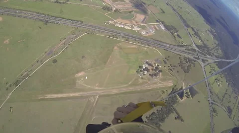 A skydiver spins while parachuting. Stockbeeldmateriaal 68573198