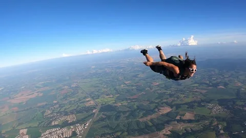 Skydiver tracking fast Stock Footage 302395875
